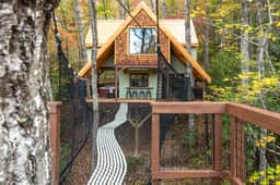 A-Frame Treehouse with Giant Treetop Net - The Carpentree